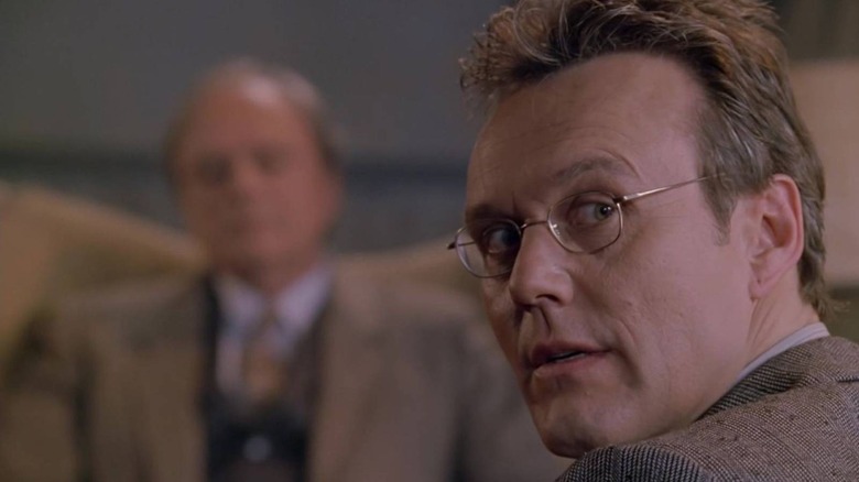 Giles looking over his shoulder on Buffy the Vampire Slayer