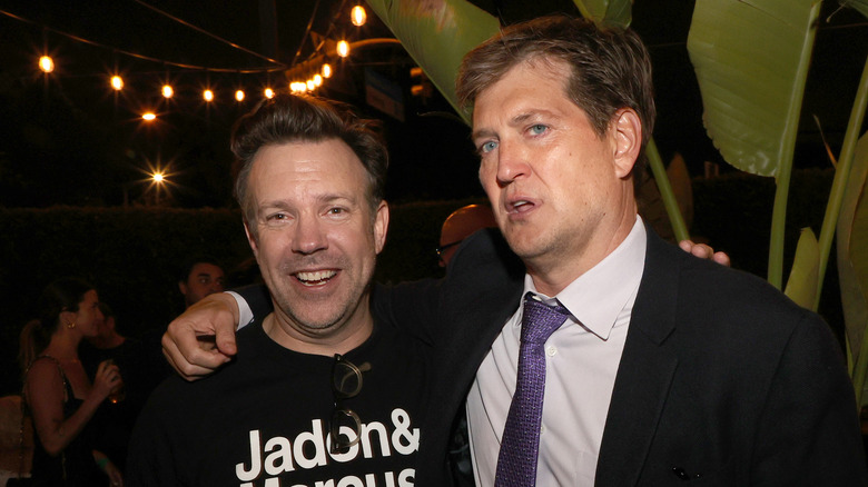 Bill Lawrence posing with his arm around Jason Sudeikis