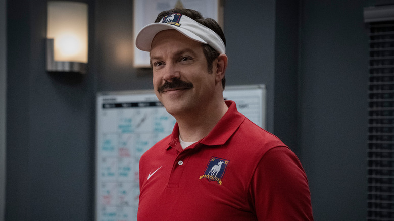 Ted Lasso wearing sun visor