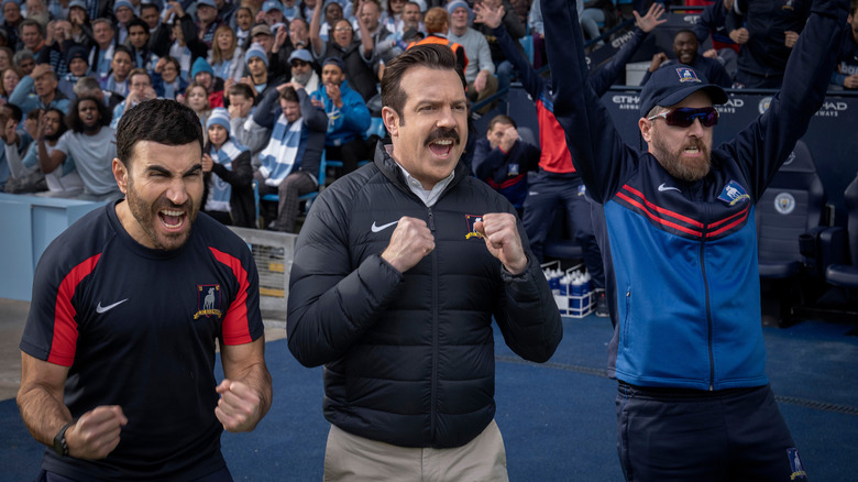 Roy, Ted, and Coach Beard cheering