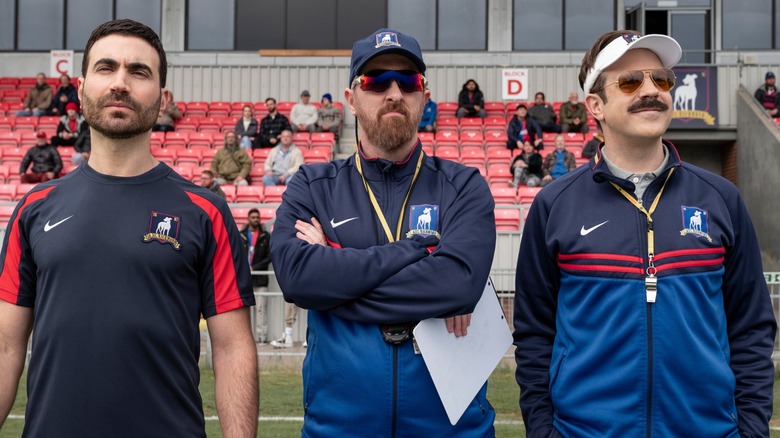 Roy, Beard, and Ted standing on field