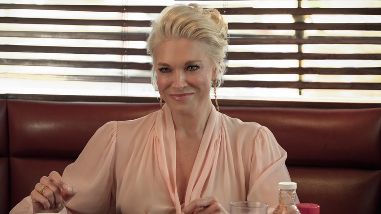 Rebecca Welton smiling and wearing a salmon shirt on Ted Lasso