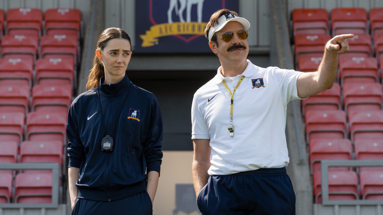 Alice and Ted standing on the sideline on Ted Lasso