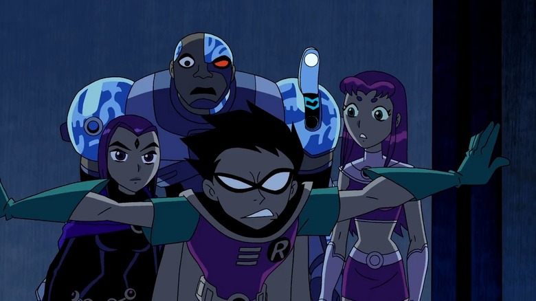 Robin leading Cyborg, Raven, and Starfire