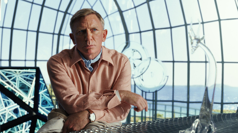 Daniel Craig as Benoit Blanc, absorbing important clues in Glass Onion (2022)