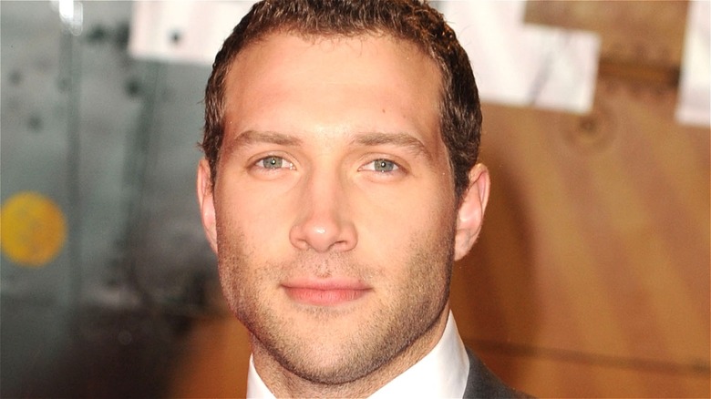 Jai Courtney smiling at public event