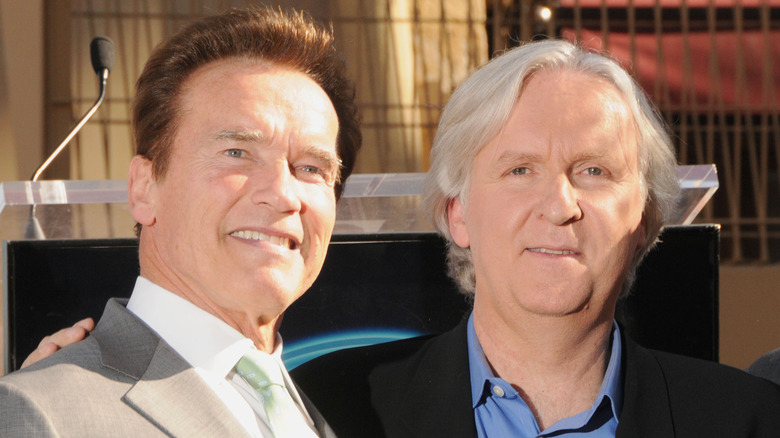 Schwarzenegger poses for a photo with Cameron