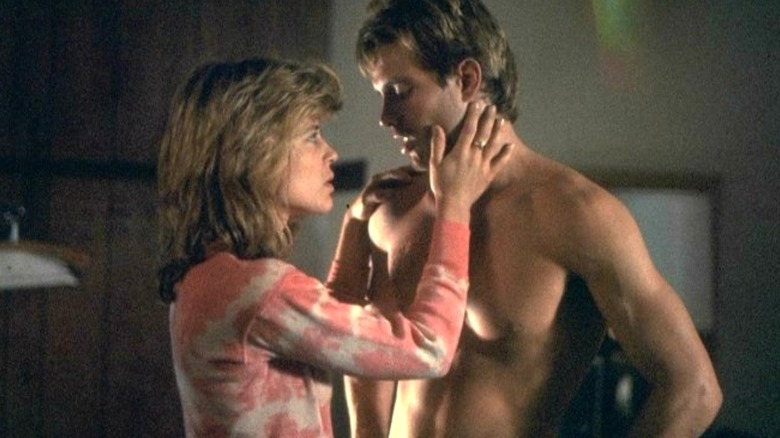 Sarah Connor grabbing Kyle Reese's face in The Terminator