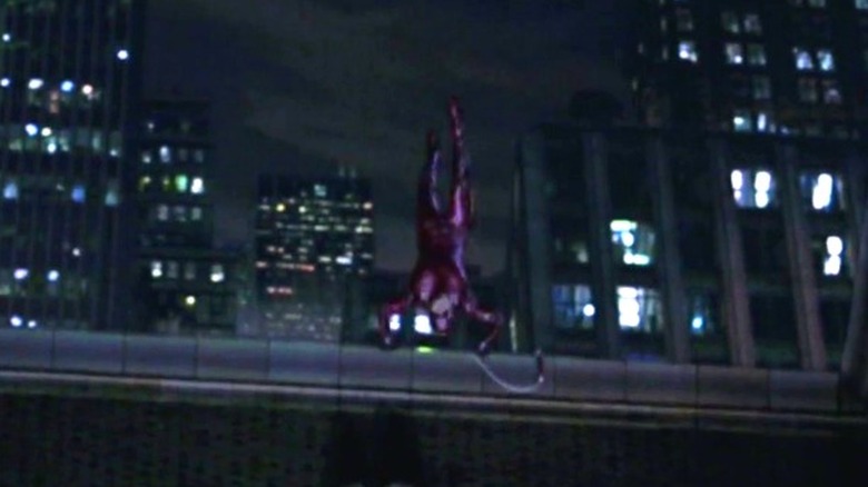 Daredevil does a handstand off the edge of a building in "Daredevil" (2003)