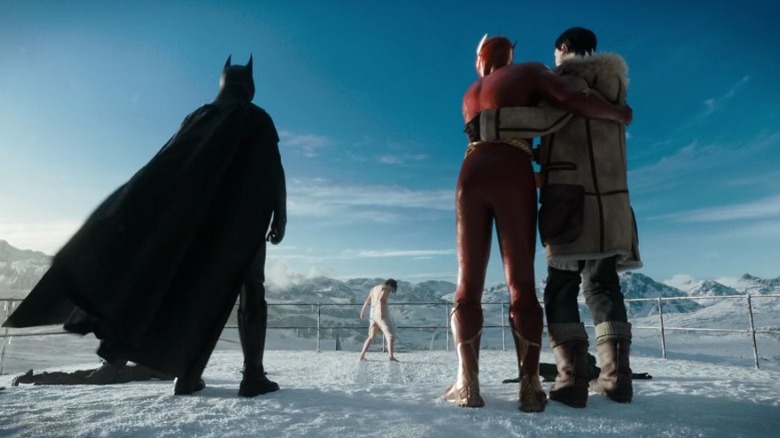 The Batman and two Barry Allens look at Supergirl from afar in "The Flash" (2023)