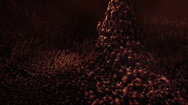 Scott Lang climbs a mountain of Ant-Man copies in "Ant-Man and the Wasp: Quantumania" (2023)