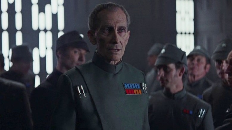 Grand Moff Tarkin is surrounded by Imperial officers in "Rogue One" (2016)