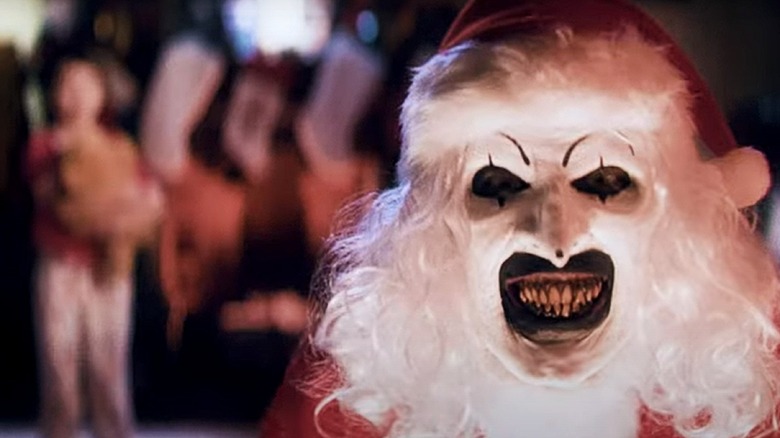 Terrifier 3's Art the Clown as Santa smiling