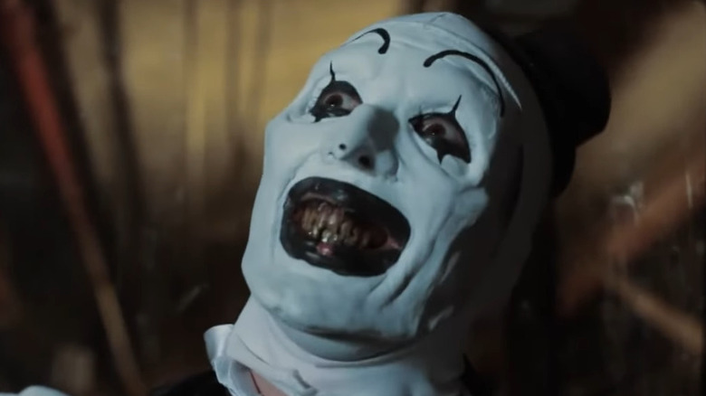 Art the Clown creepily looking up in All Hallows' Eve