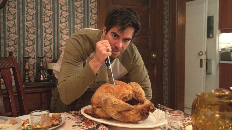 Eli Roth stabbing cooked turkey