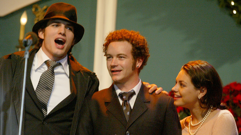 Ashton Kutcher, Danny Masterson and Mila Kunis performing at the Church of Scientology's 11th Annual Christmas Stories Fundraiser in 2003