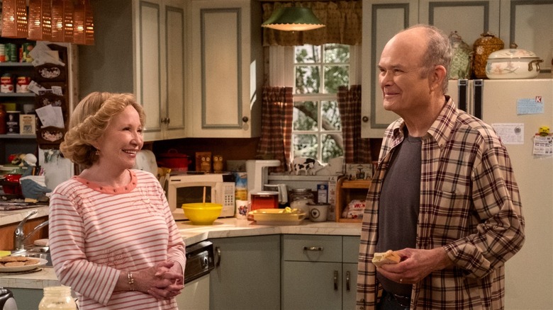 Red and Kitty smiling in the kitchen