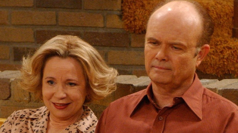 Kitty and Red Forman sit on the living room couch