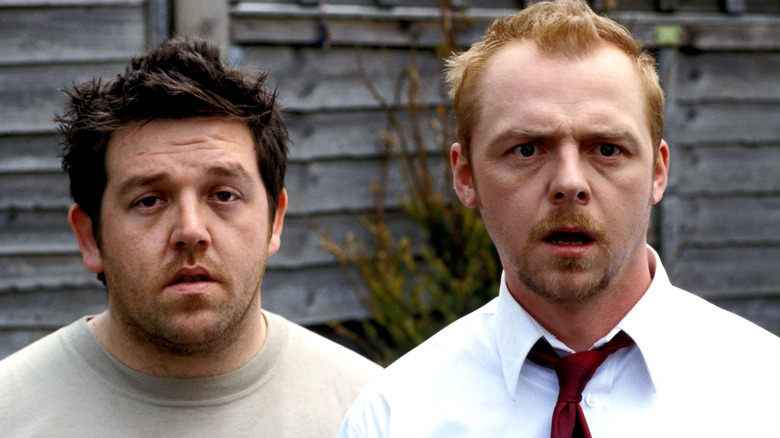 Ed and Shaun in backyard with zombies Shaun of the Dead