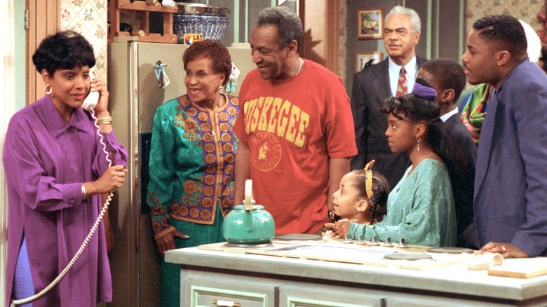 The Cosby family gathered together in the kitchen in "The Cosby Show"