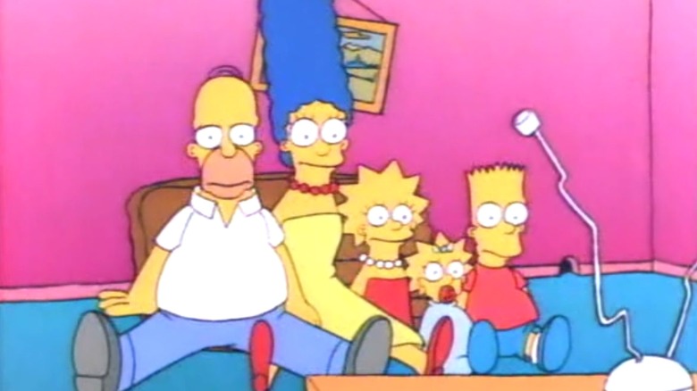 Homer, Marge, Lisa, Maggie, and Bart watching TV in "The Simpsons"