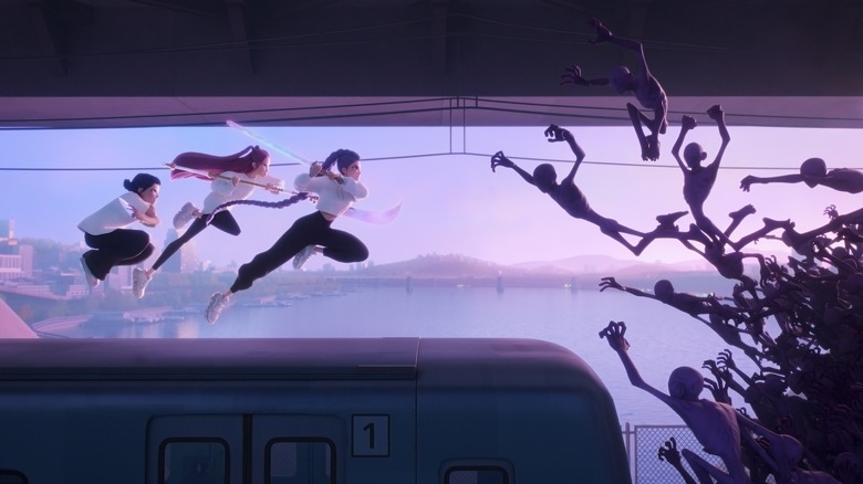 Huntr/x take on a group of demons on top of a train in KPop Demon Hunters