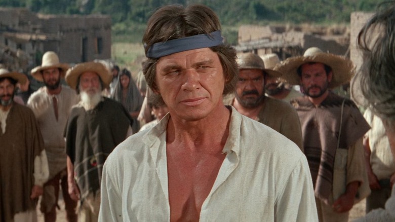 Charles Bronson squints in the sun