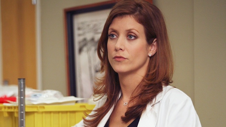 Addison standing in a hospital hallway on Grey's Anatomy