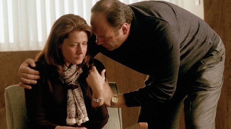Tony leaning down to talk to an upset Dr. Melfi on The Sopranos
