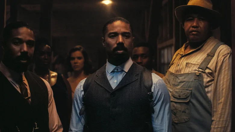 Smoke, Stack, Mary, and others crowded in doorway in Sinners