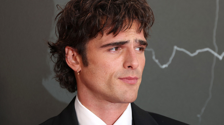 Jacob Elordi in a suit and wearing an earring