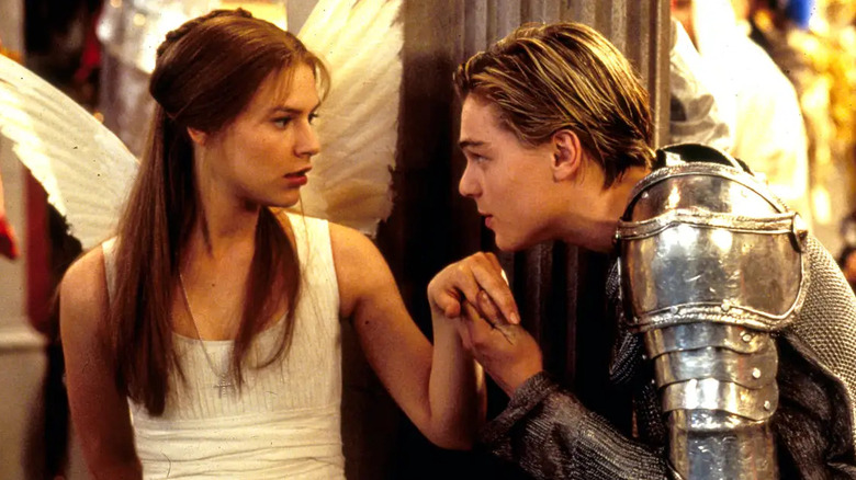 Romeo kissing Juliet's hand in Romeo + Juliet