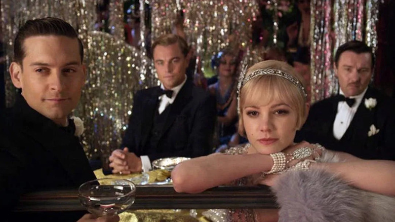 Nick Jay Daisy and Tom watching a show in The Great Gatsby