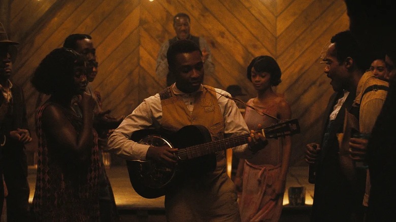 Sammie performing for the juke joint in "Sinners" (2025)