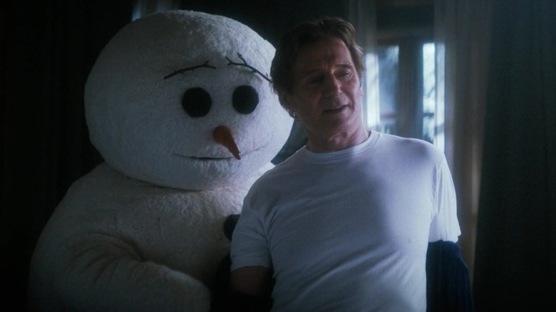 A snowman undresses Frank Drebin Jr. in "The Naked Gun" (2025)