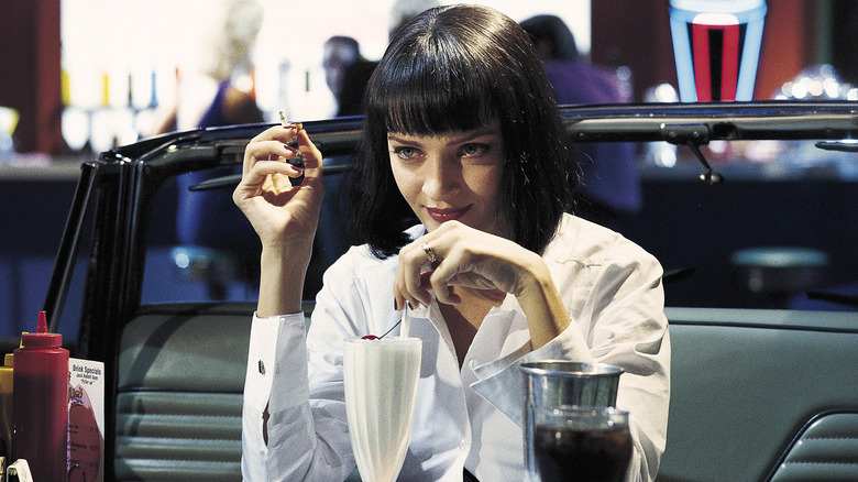 Mia smoking a cigarette at the diner in Pulp Fiction