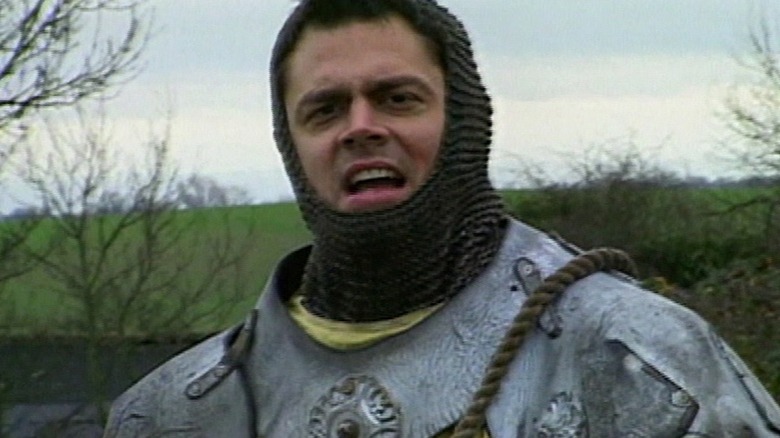 Johnny Knoxville wearing a suit of armor in Jackass Season 1