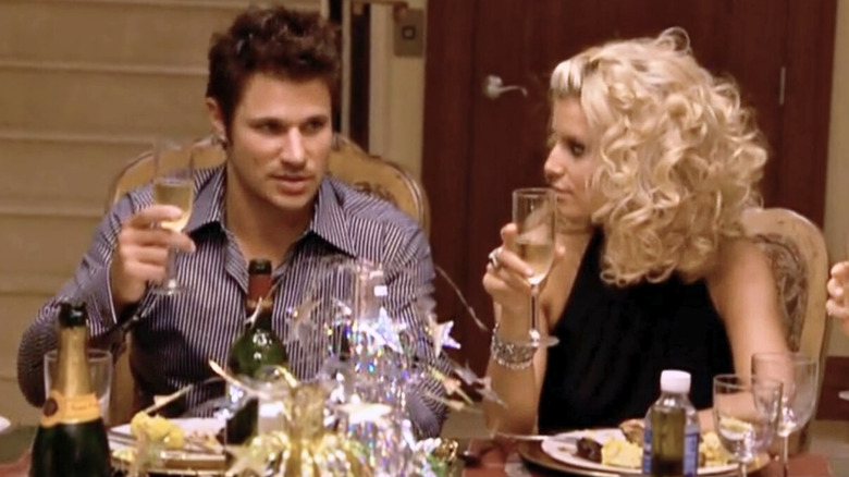 Nick and Jessica toasting with champagne in Newlyweds: Nick and Jessica