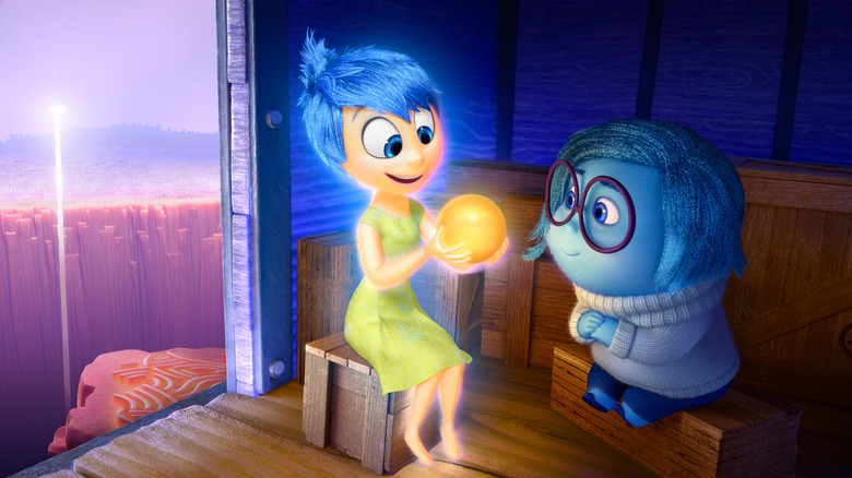 Joy holding a Core Memory for Sadness to admire in Inside Out