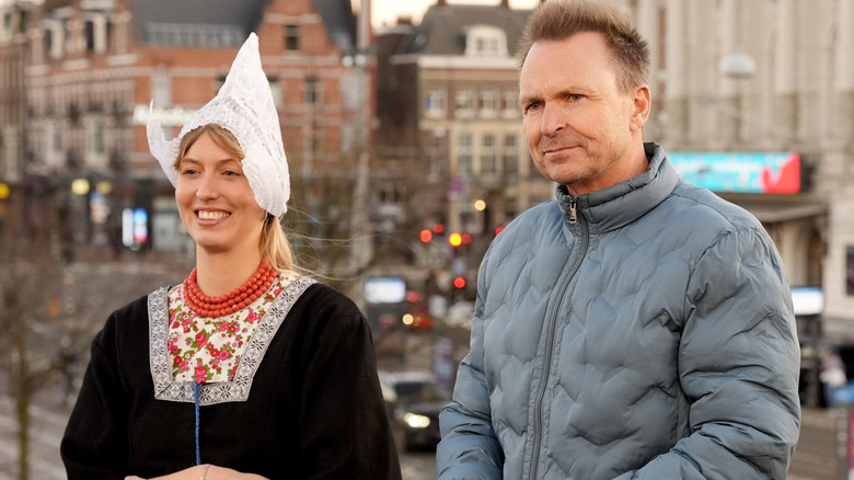 Phil Keoghan and a greeter in "The Amazing Race" (2001-present)