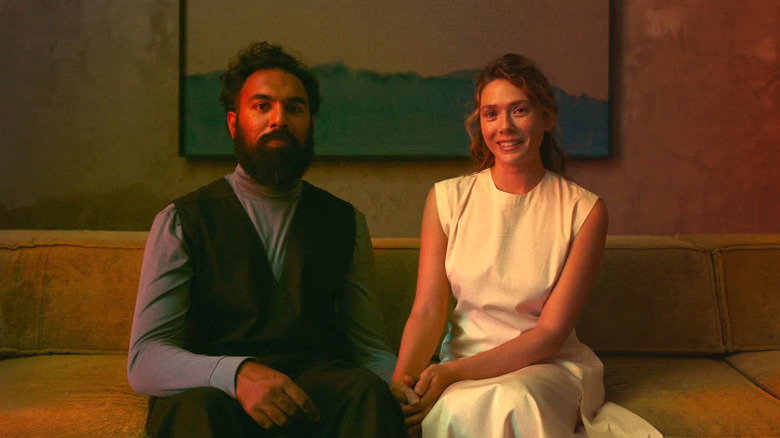 Aaryan and Mia posing on couch in "The Assessment"