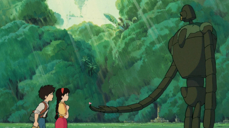 A robot hands Pazu and Sheeta a flower in "Castle in the Sky" (1986)