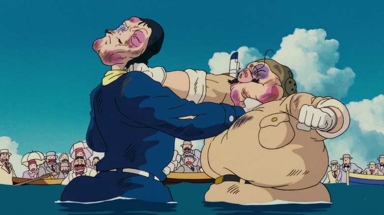 Curtis and Marco punch each other standing in the water in "Porco Rosso" (1992)