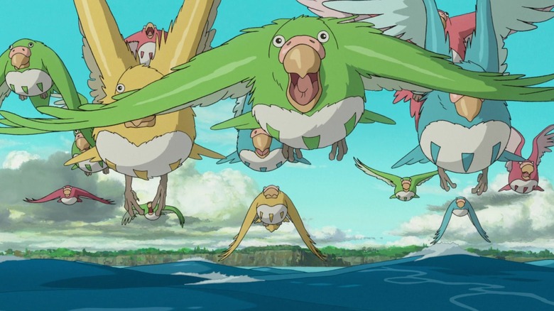 Parakeets fly over the ocean in "The Boy and the Heron" (2023)