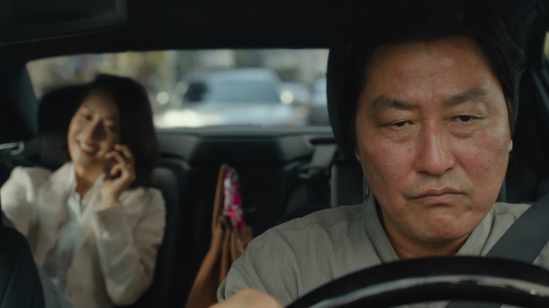 Angry Ki-Taek drives an oblivious Mrs. Park in Parasite (2019)