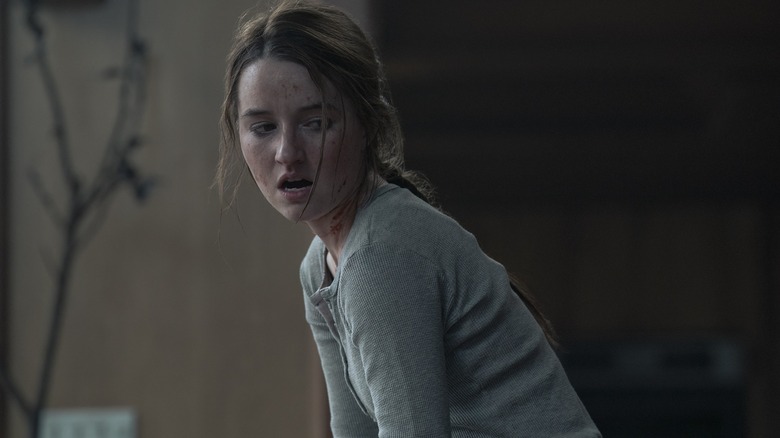 Abby with blood on her face gasping and looking to the side on The Last of Us