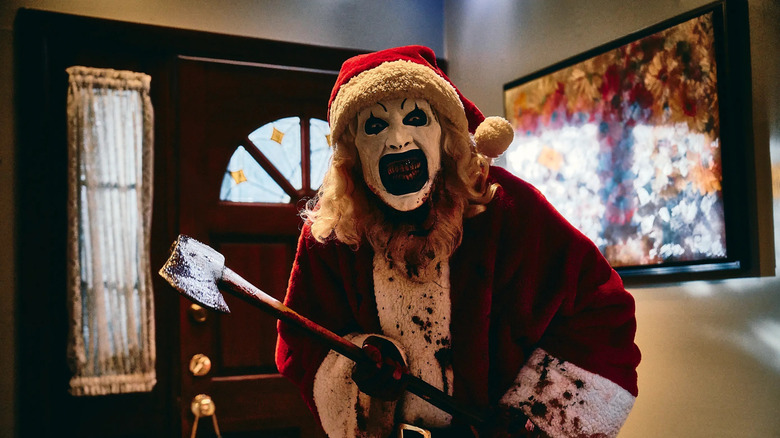 Art the Clown slaying the innocent on Christmas in "Terrifier 3" (2025)