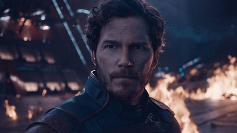 Peter standing with flames behind him in "Guardians of the Galaxy Vol. 3" (2023)