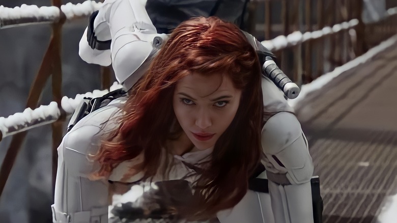 Natasha landing on a walkway in "Black Widow" (2021)