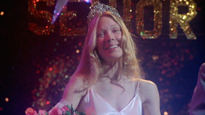 Carrie smiling in her prom dress